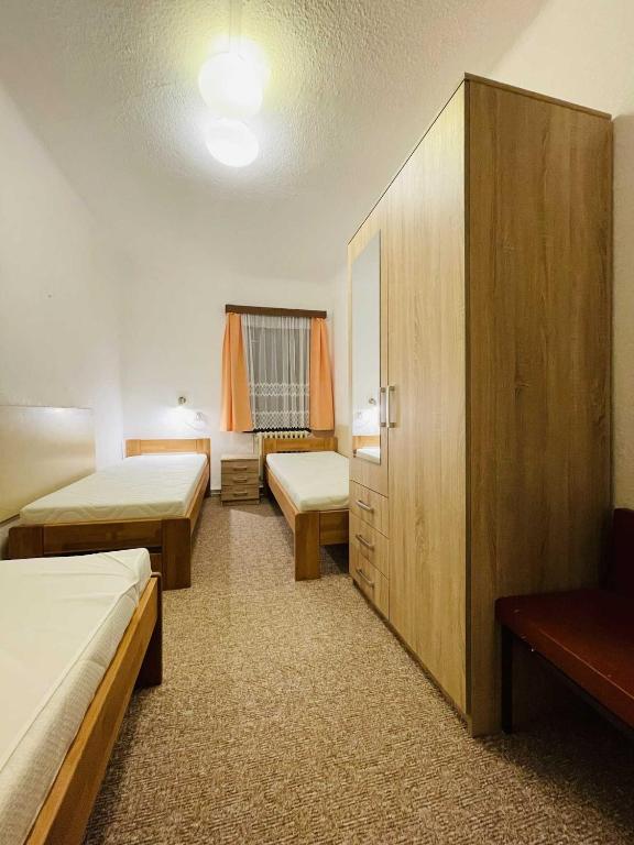 Postel nebo postele na pokoji v ubytování Hotel Zlatá vyhlídka
