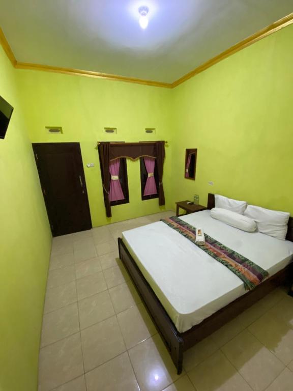 Postel nebo postele na pokoji v ubytování Watukarung Sackstone Guesthouse