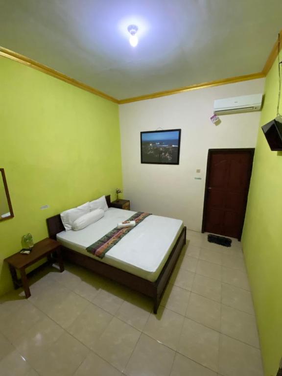 Postel nebo postele na pokoji v ubytování Watukarung Sackstone Guesthouse