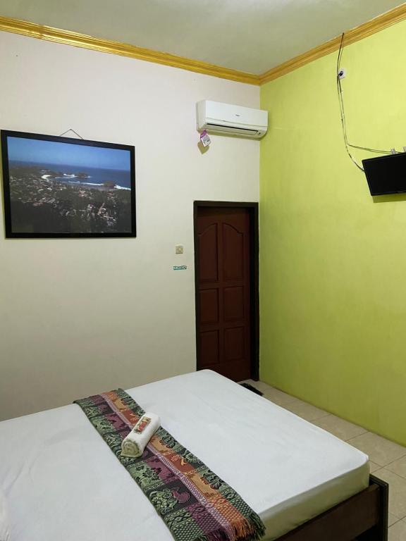 Postel nebo postele na pokoji v ubytování Watukarung Sackstone Guesthouse