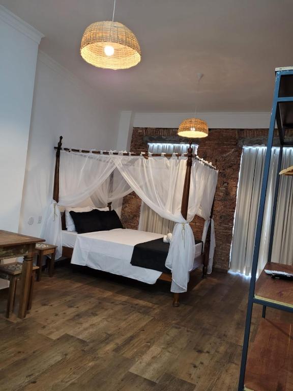 Postel nebo postele na pokoji v ubytování Pelourinho Boutique Hotel - OH HOTÉIS