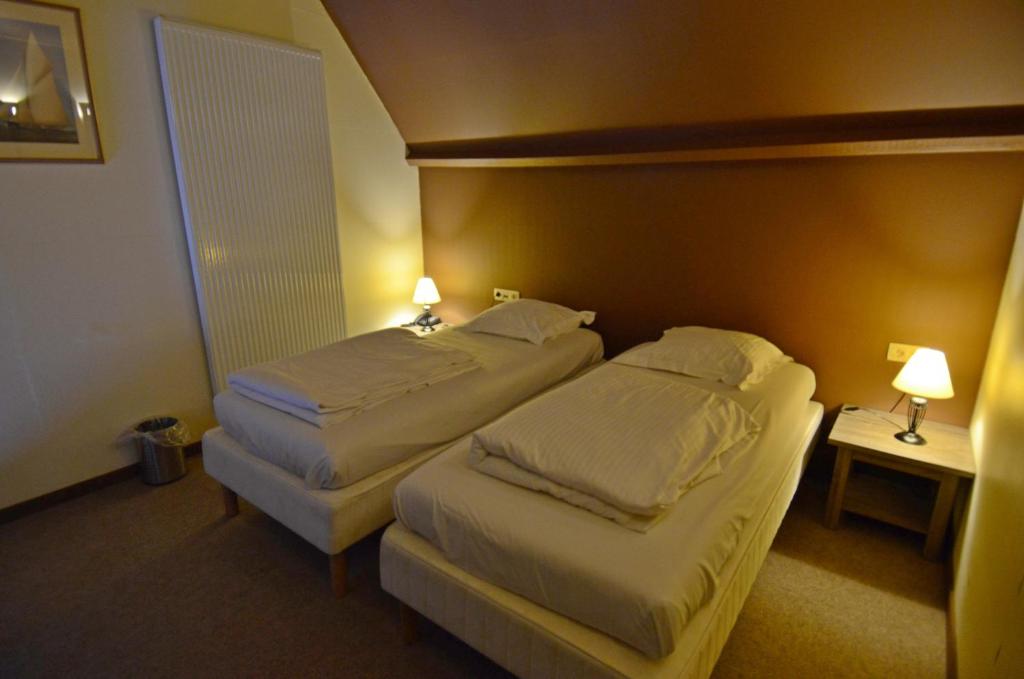 Postel nebo postele na pokoji v ubytování Hotel Malcot