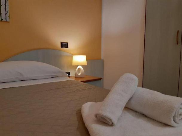 Postel nebo postele na pokoji v ubytování Hotel La Plancia