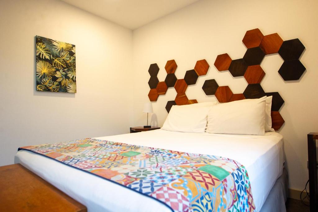 Postel nebo postele na pokoji v ubytování La Vela Boutique Hotel