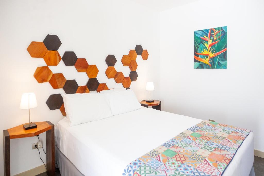 Postel nebo postele na pokoji v ubytování La Vela Boutique Hotel