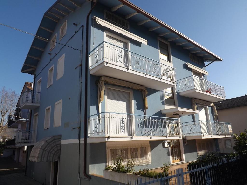 a blue building with white balconies on it at Appartamenti Muccioli Misano in Misano Adriatico