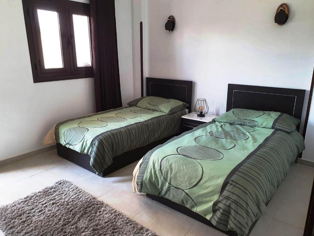 Postel nebo postele na pokoji v ubytování CASA LOKO Guest House