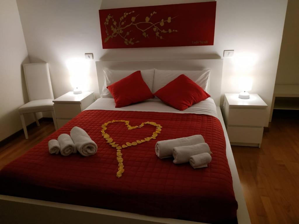A bed or beds in a room at Loft VERDI Holiday Viterbo
