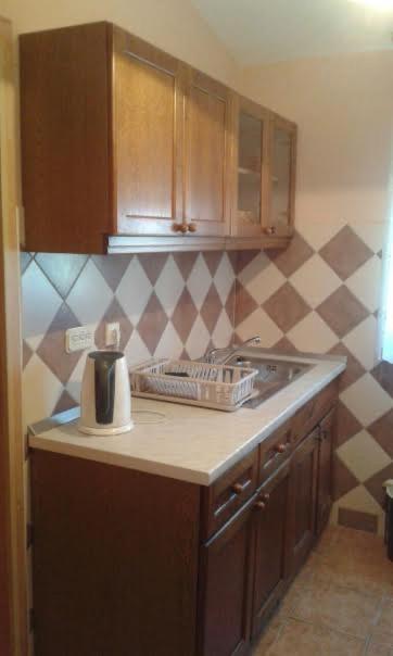 Kuchyňa alebo kuchynka v ubytovaní Apartman Ivica
