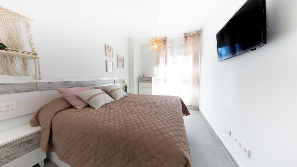 Posteľ alebo postele v izbe v ubytovaní Viento Grande, Apartamento boutique en la playa