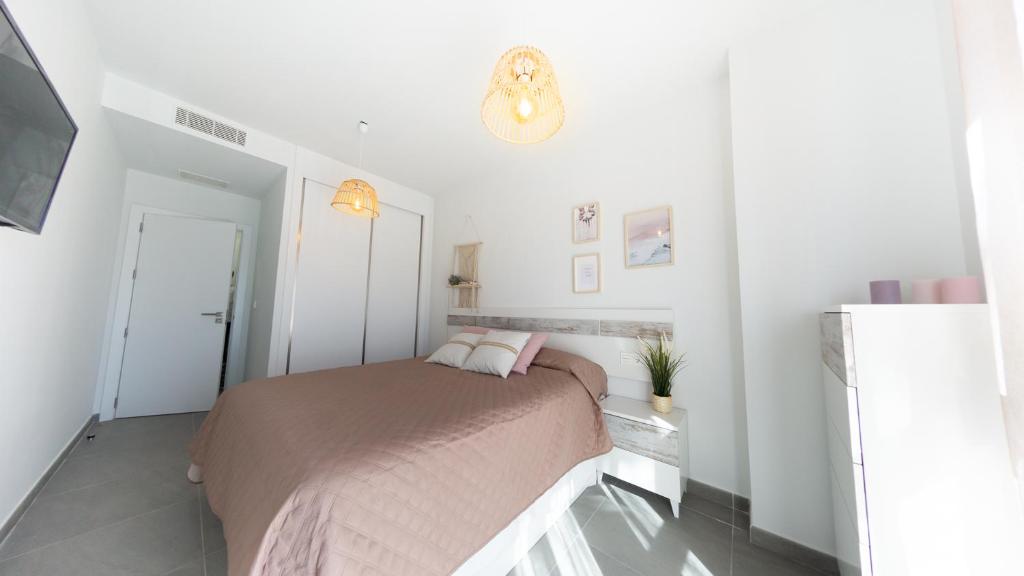 Posteľ alebo postele v izbe v ubytovaní Viento Grande, Apartamento boutique en la playa