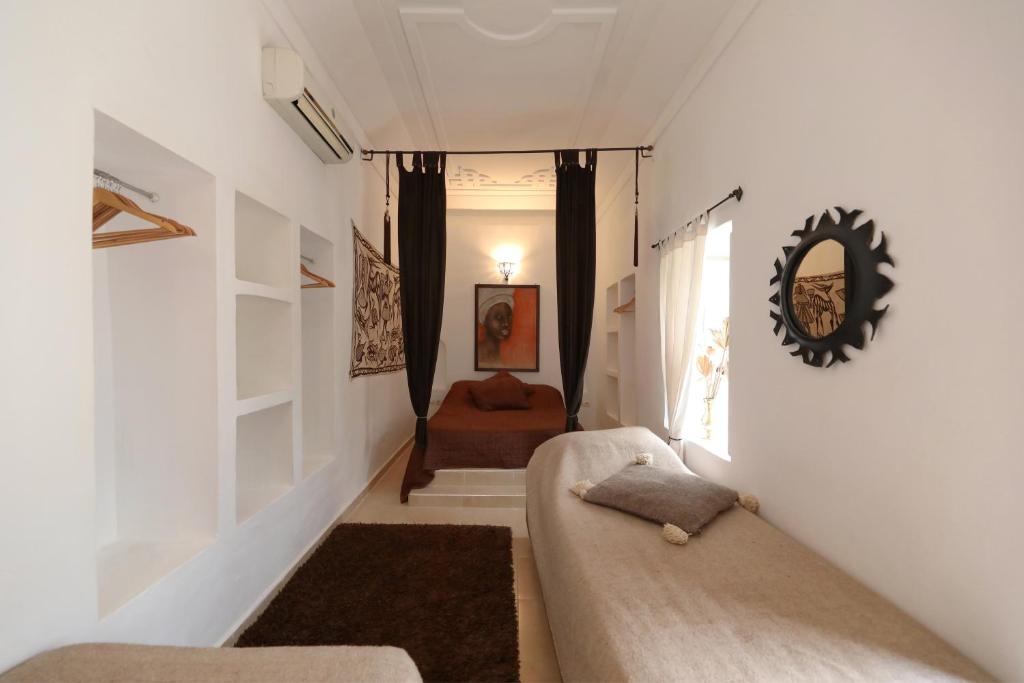 Postel nebo postele na pokoji v ubytování Riad Noor Charana