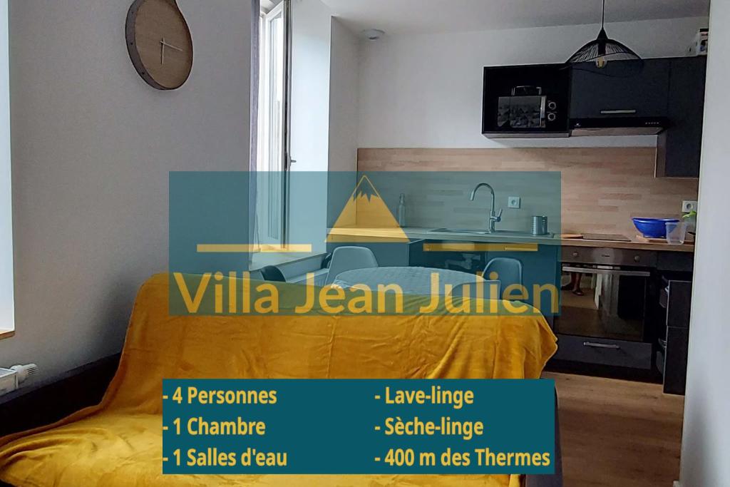 a room with a yellow bed and a kitchen at Villa Jean Julien - Le Capucin - Appartement T1 - 1 chambres - 4 personnes in Le Mont-Dore