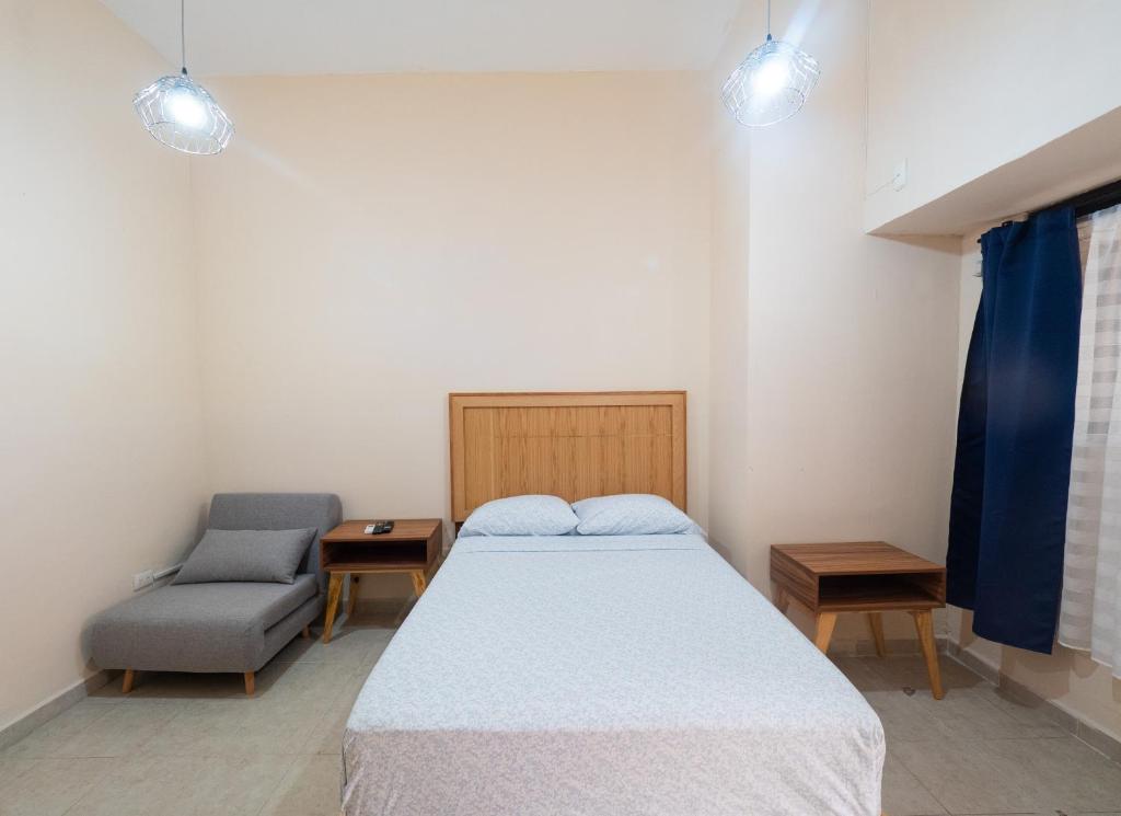 Postel nebo postele na pokoji v ubytování Nido Colibrí - Private Rooms and hostel Dorms in Remate de Paseo Montejo