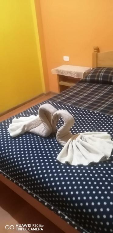 Postel nebo postele na pokoji v ubytování Hostal el Vaquero