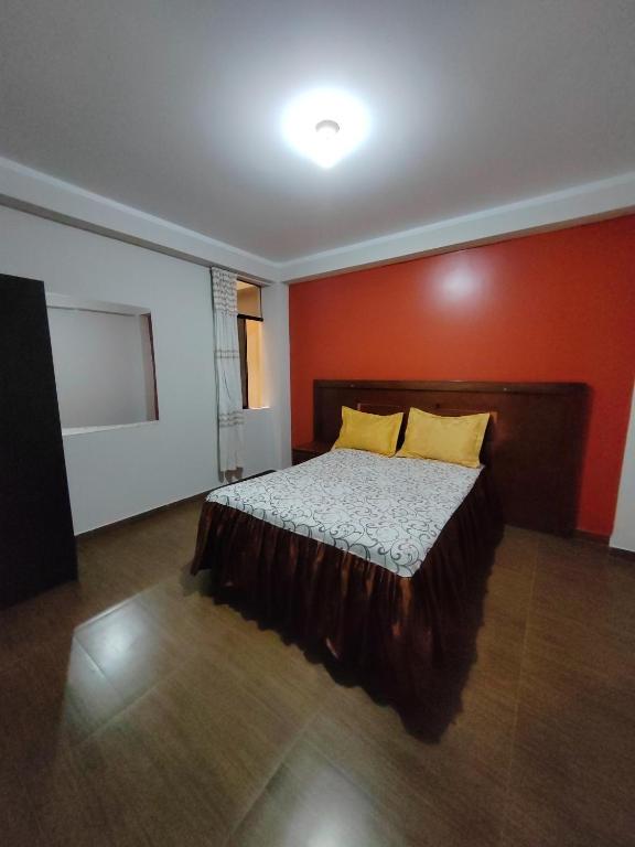 Postel nebo postele na pokoji v ubytování Hostal Bryan