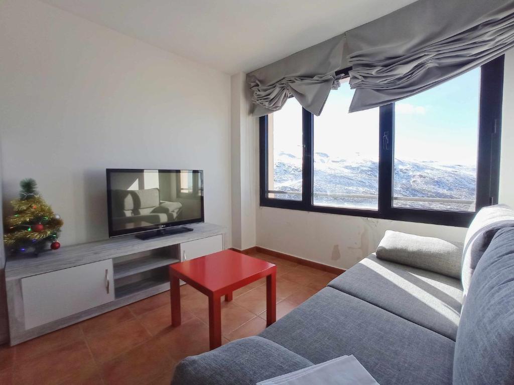 TV a/nebo společenská místnost v ubytování Apartamento familiar