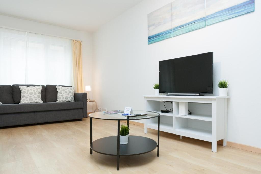 TV a/nebo společenská místnost v ubytování Galaxy Apartments Lucerne