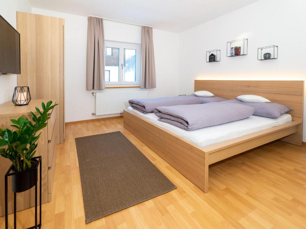 Postel nebo postele na pokoji v ubytování Haus Andrea