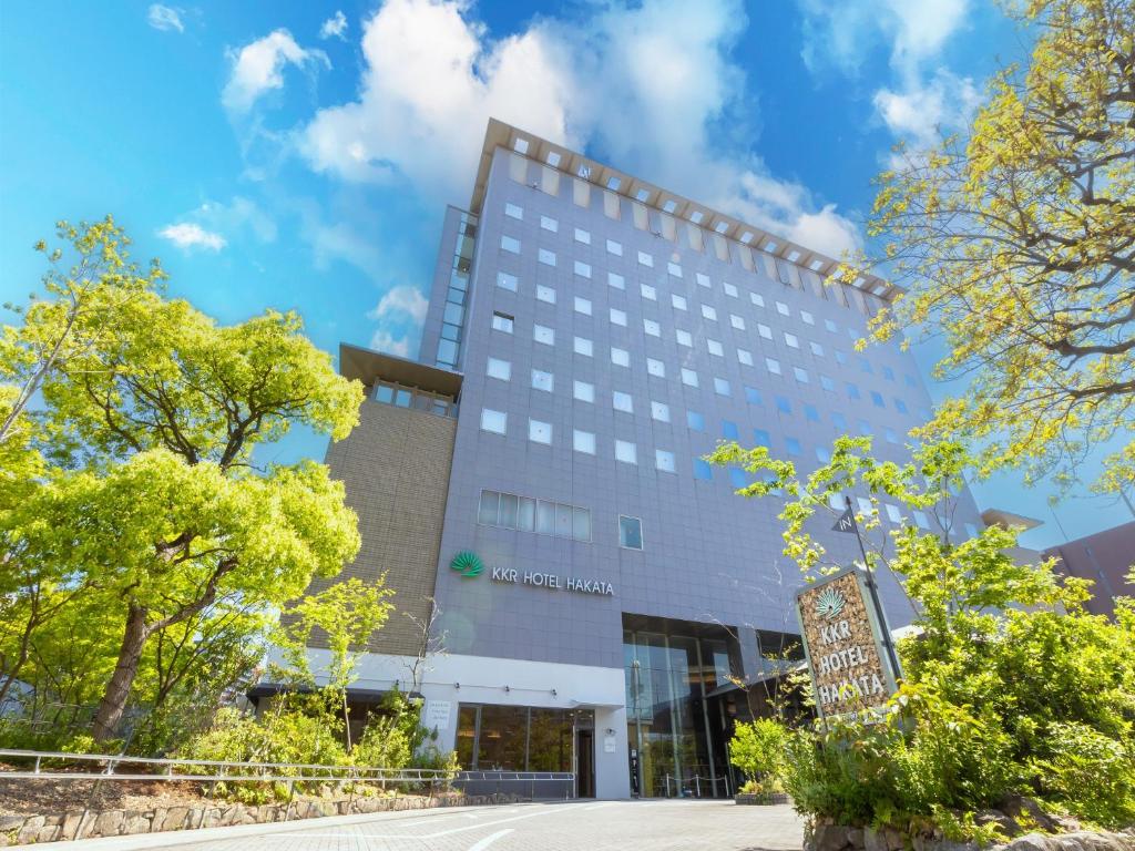 a building with a sign in front of it at KKR Hotel Hakata in Fukuoka