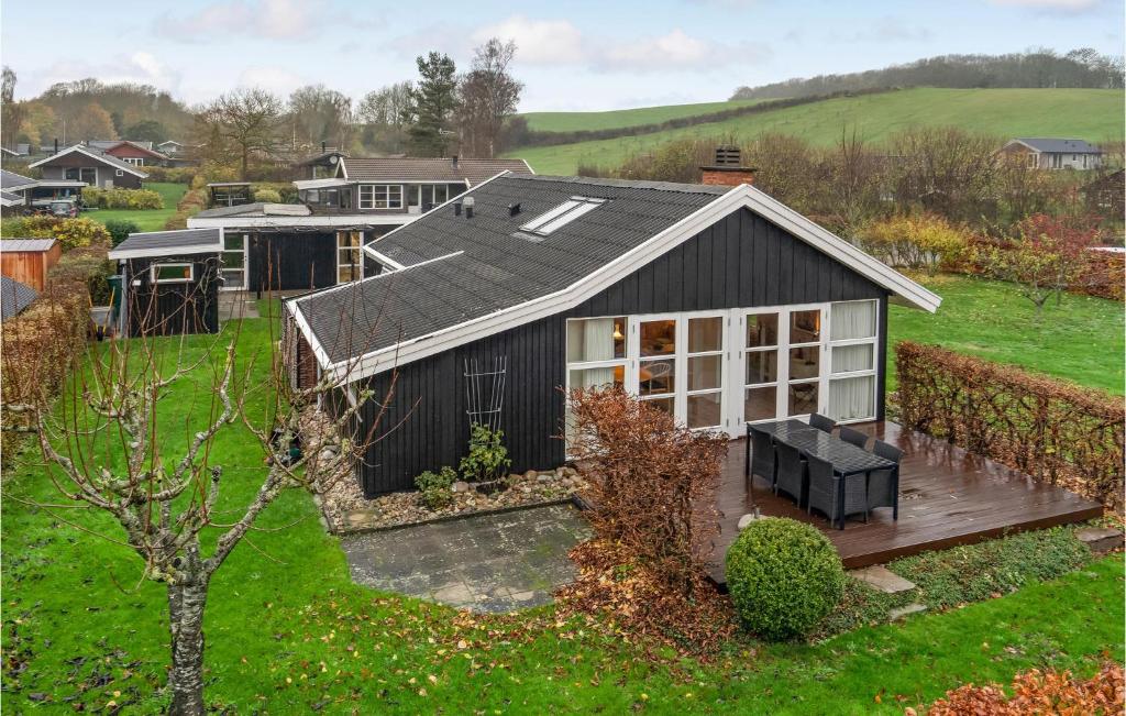 an aerial view of a house with a roof at Awesome Home In Haarby With Jacuzzi, 3 Bedrooms And Wifi in Hårby