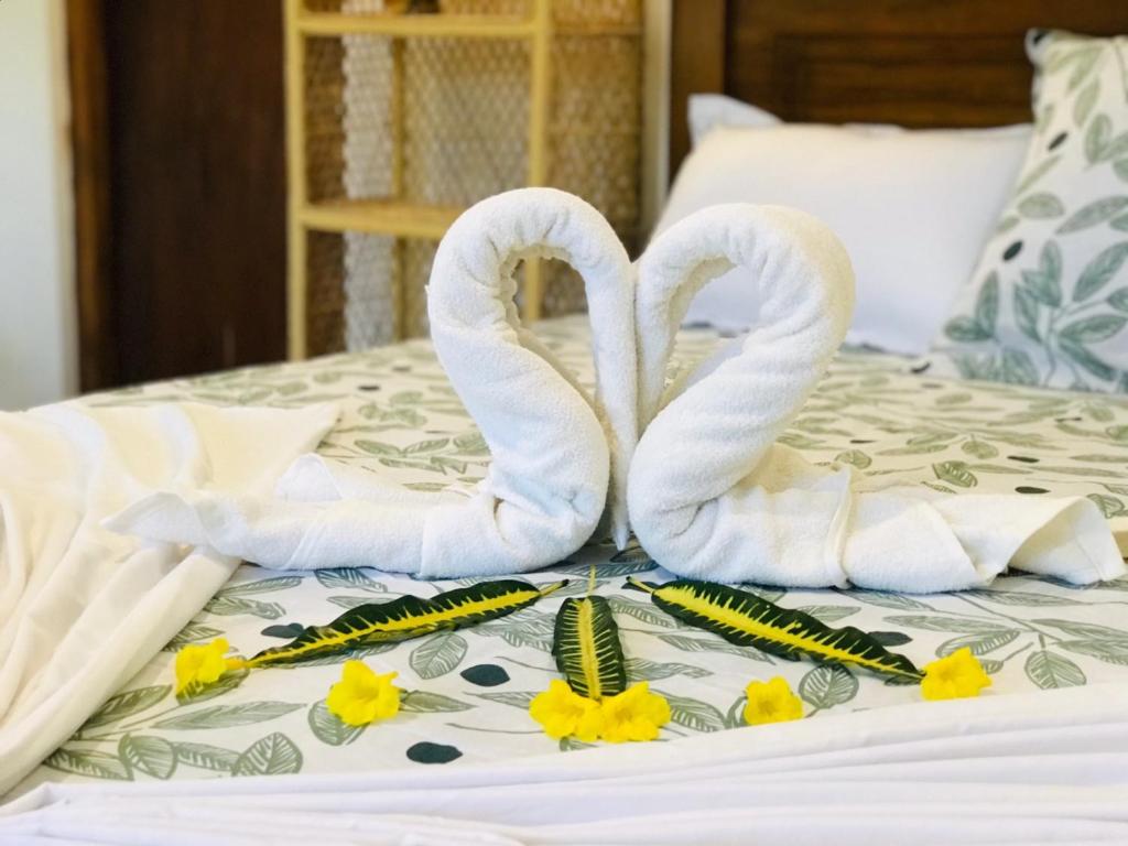 Postel nebo postele na pokoji v ubytování Coco Eco Lodge