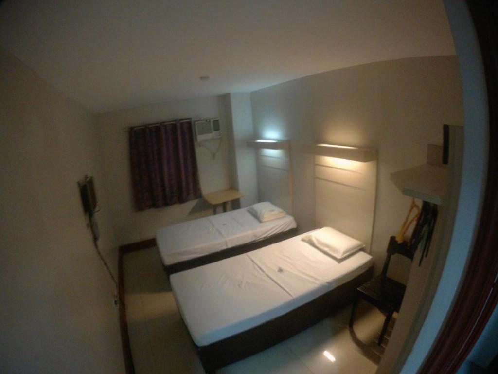 Postel nebo postele na pokoji v ubytování D' Loft Inn CDO