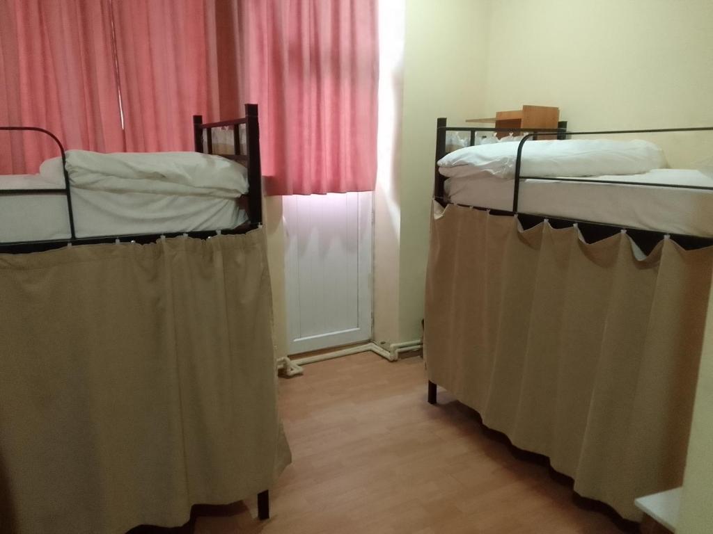 Postel nebo postele na pokoji v ubytování Wine Hostel
