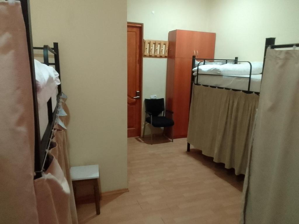 Postel nebo postele na pokoji v ubytování Wine Hostel