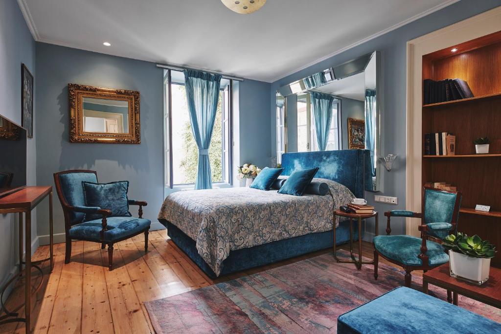 Postel nebo postele na pokoji v ubytování Bohemian Suites Athens