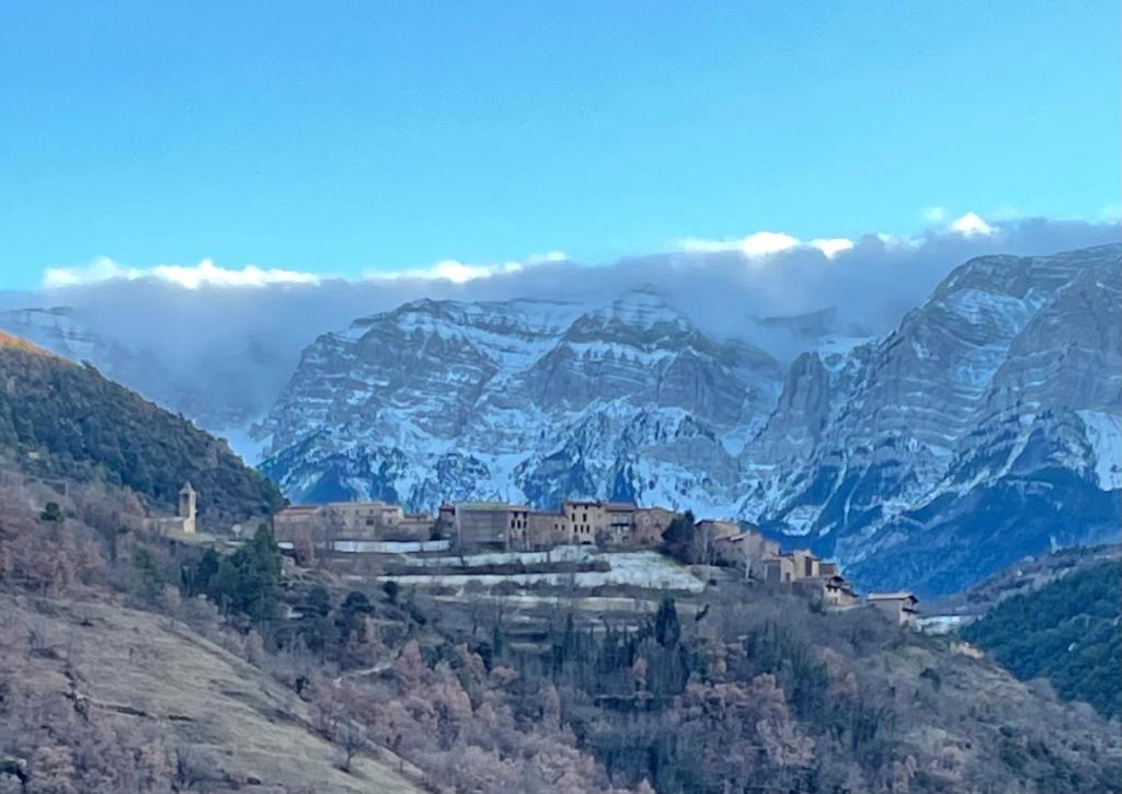a monastery on the side of a mountain at Apartament Cal Marinall in Arsèguel