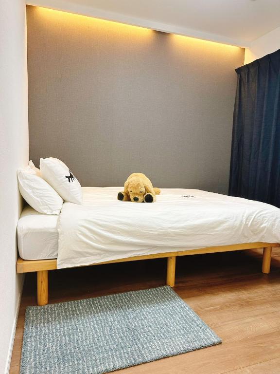 Postel nebo postele na pokoji v ubytování Linn 阿倍野