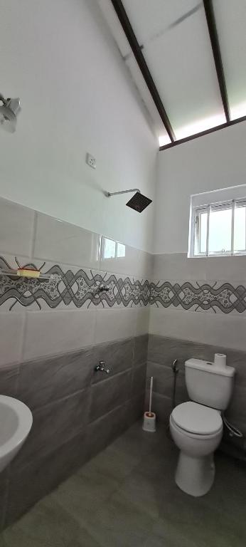 Koupelna v ubytování Wimala B&B
