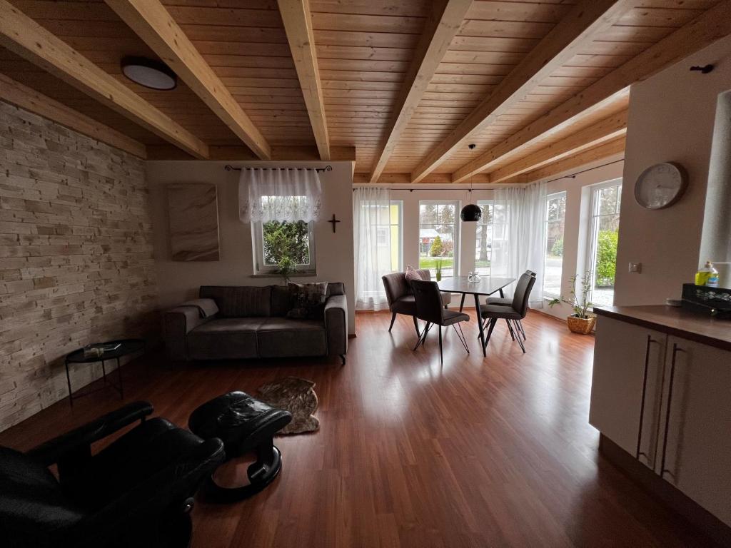 a living room with a couch and a table at Villa Toskana Wohnung 2 in Wackersdorf