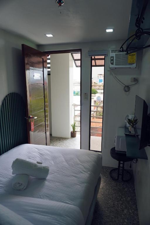 Postel nebo postele na pokoji v ubytování Cebu Backpackers Hostel