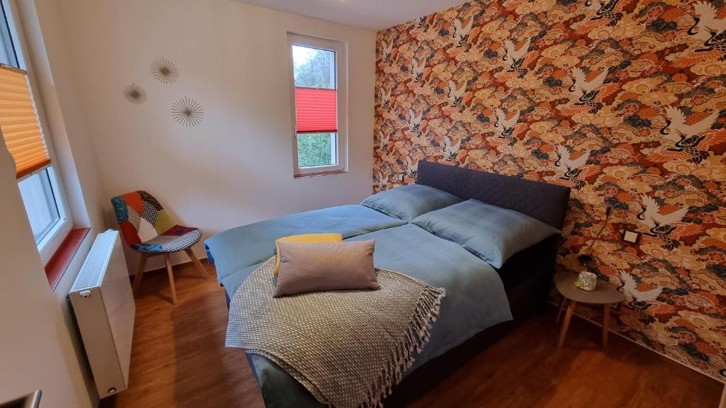 Postel nebo postele na pokoji v ubytování Ferienhaus Rehblick - direkt in der Natur, mit Lesezimmer und zwei Terrassen