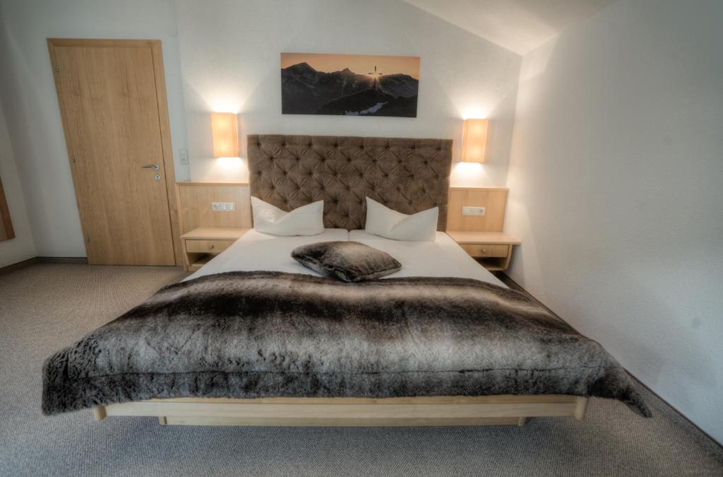 Postel nebo postele na pokoji v ubytování Ferienhaus & Apart Post