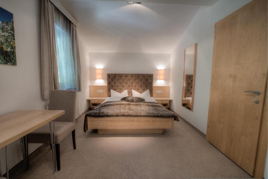 Postel nebo postele na pokoji v ubytování Ferienhaus & Apart Post
