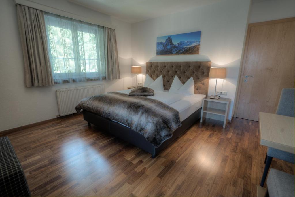 Postel nebo postele na pokoji v ubytování Ferienhaus & Apart Post