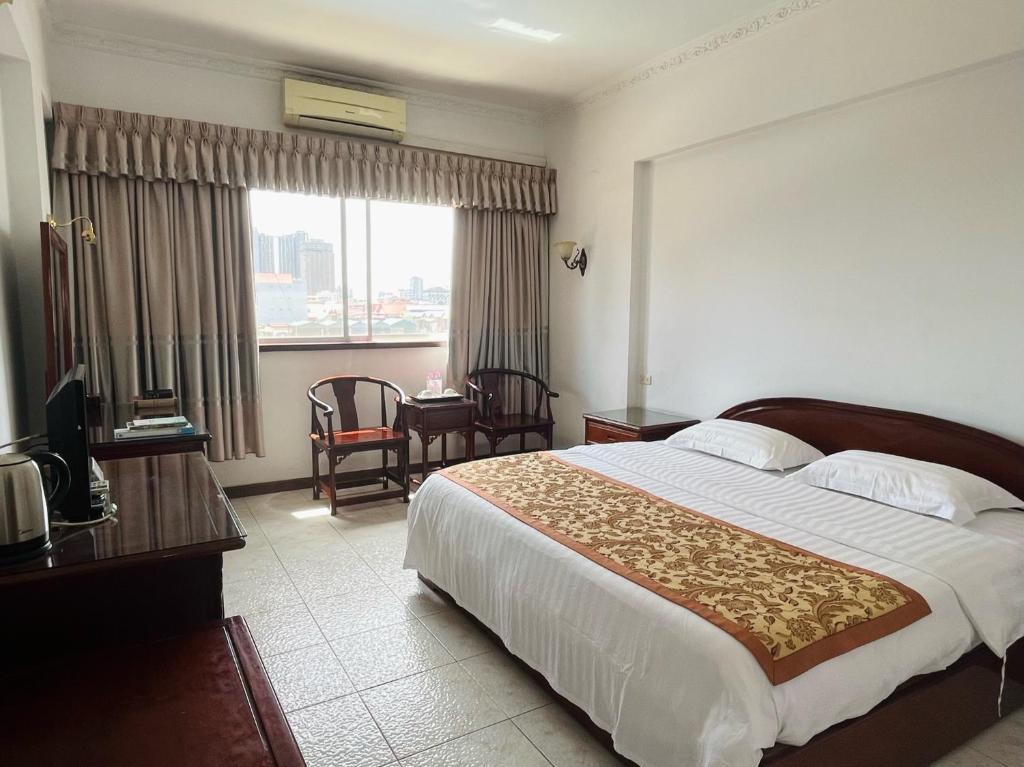 Postel nebo postele na pokoji v ubytování Chung Hsin Hotel 中信酒店