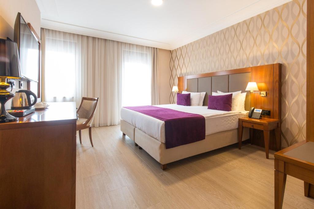 Postel nebo postele na pokoji v ubytování Xenon Hotel & SPA