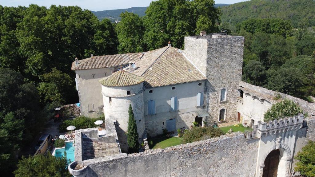 an old castle sitting on top of a wall at Chateau de la Bastide in Goudargues