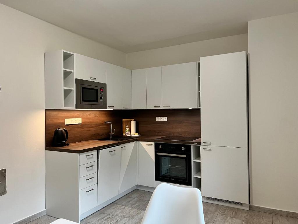 Kuchyň nebo kuchyňský kout v ubytování Apartmány Victory Residence