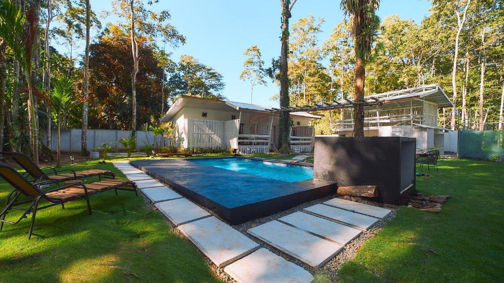 a swimming pool in the backyard of a house at Olivia del caribe suite in Puerto Viejo