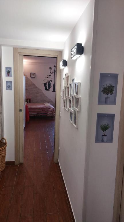 A bed or beds in a room at A casa di Delia - stazione Fidene