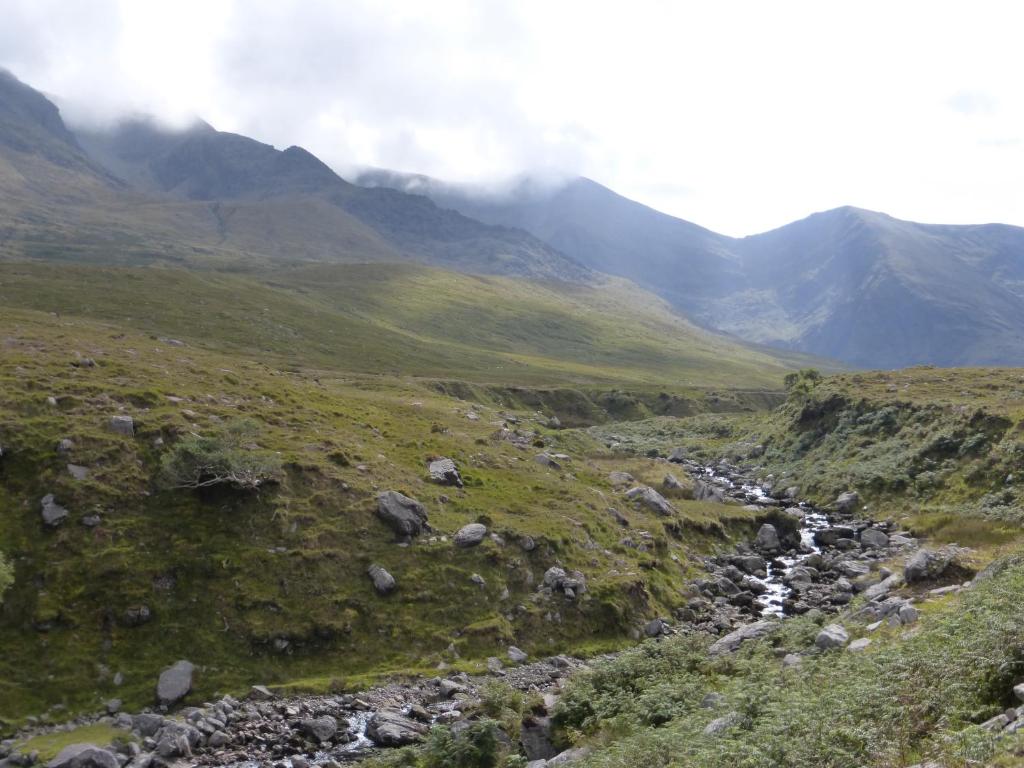 a river in a valley with mountains in the background at Oakfield in Kenmare
