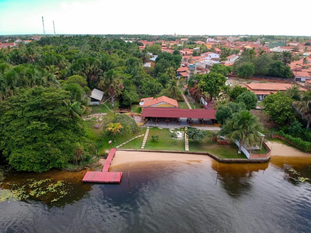 an aerial view of a house on the water at Pousada Murici in Barreirinhas