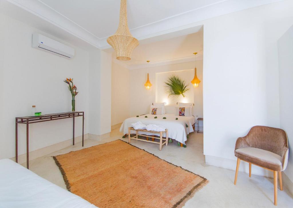 Postel nebo postele na pokoji v ubytování RIAD 48 & SPA