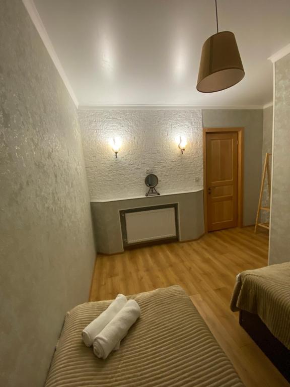 Postel nebo postele na pokoji v ubytování Guesthouse SHAMPRIANI