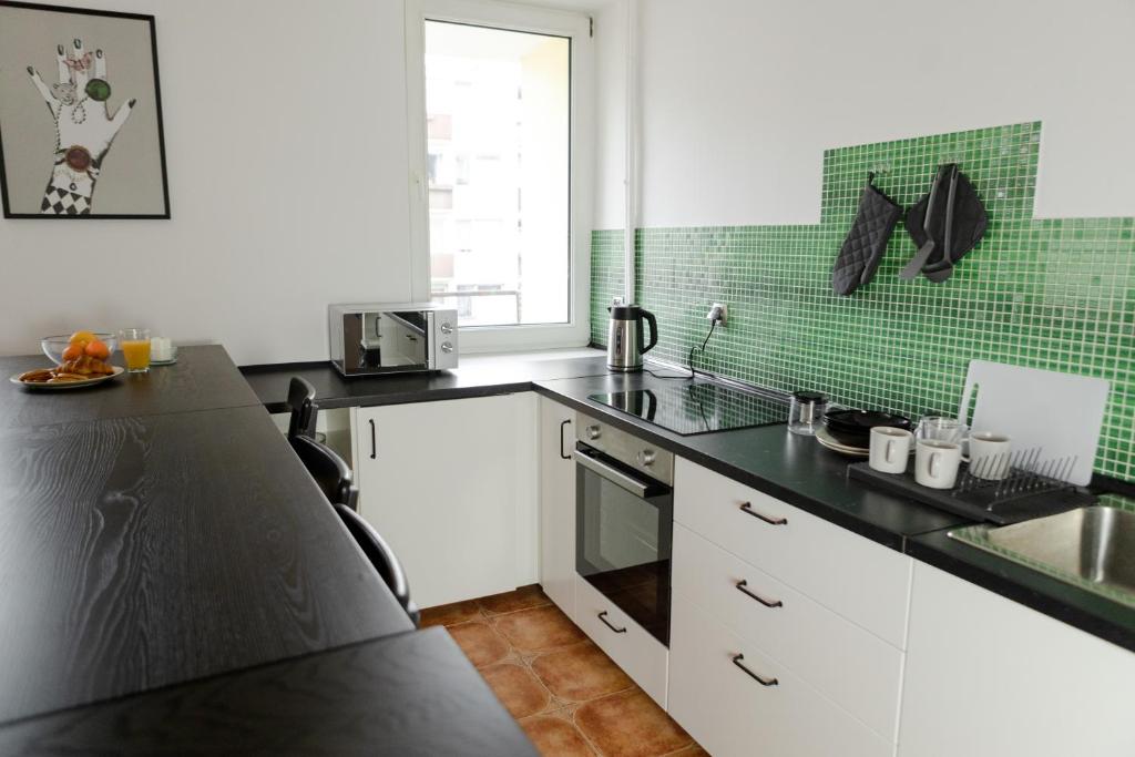 Kuchyňa alebo kuchynka v ubytovaní Wow Rooms